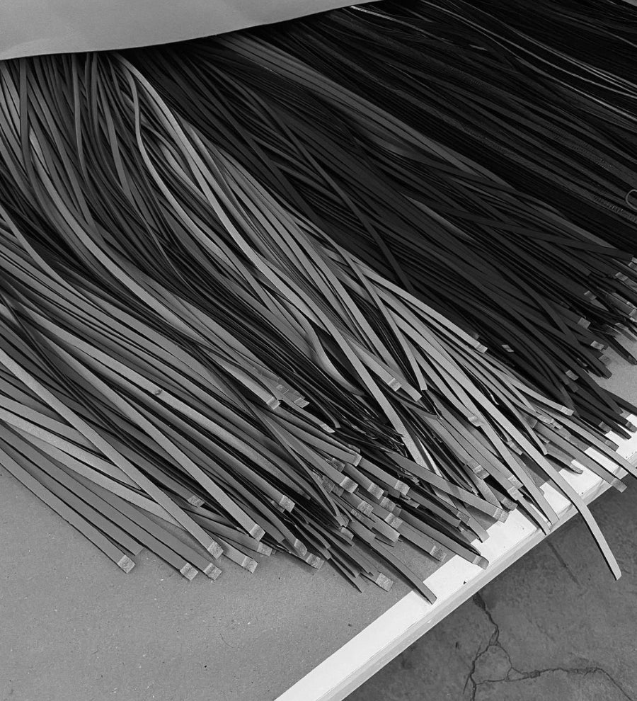Picture of slim cut leather in the process of production by Manu Atelier